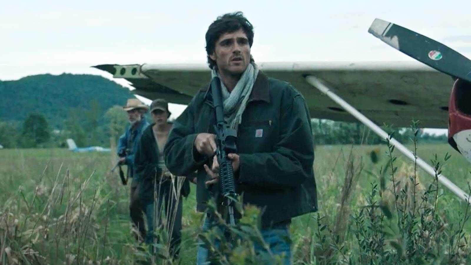 Jacob Elordi, Margaret Qualley, and Guy Pearce with guns in The Dog Stars