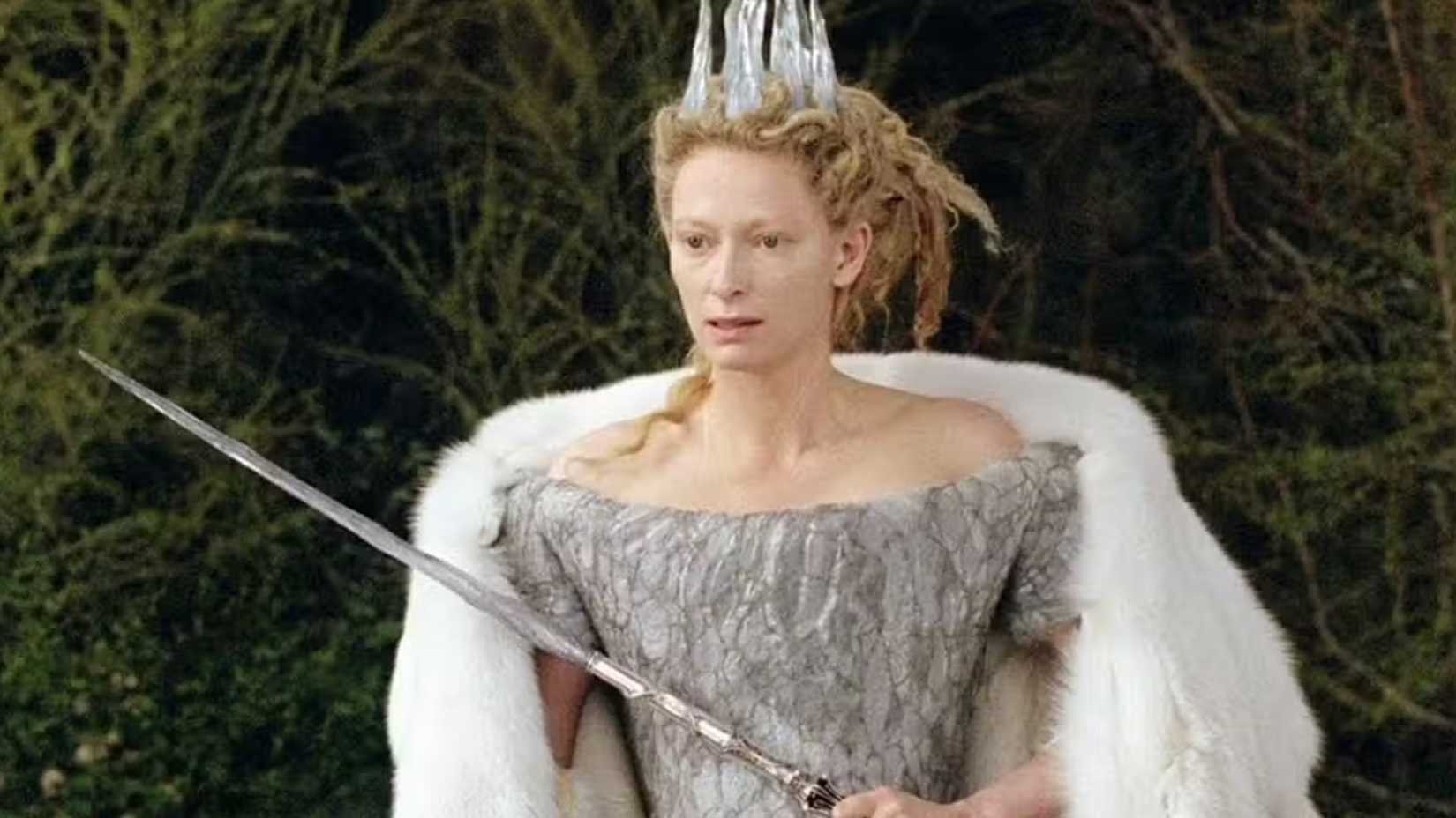 Jadis the White Witch holds her scepter. 