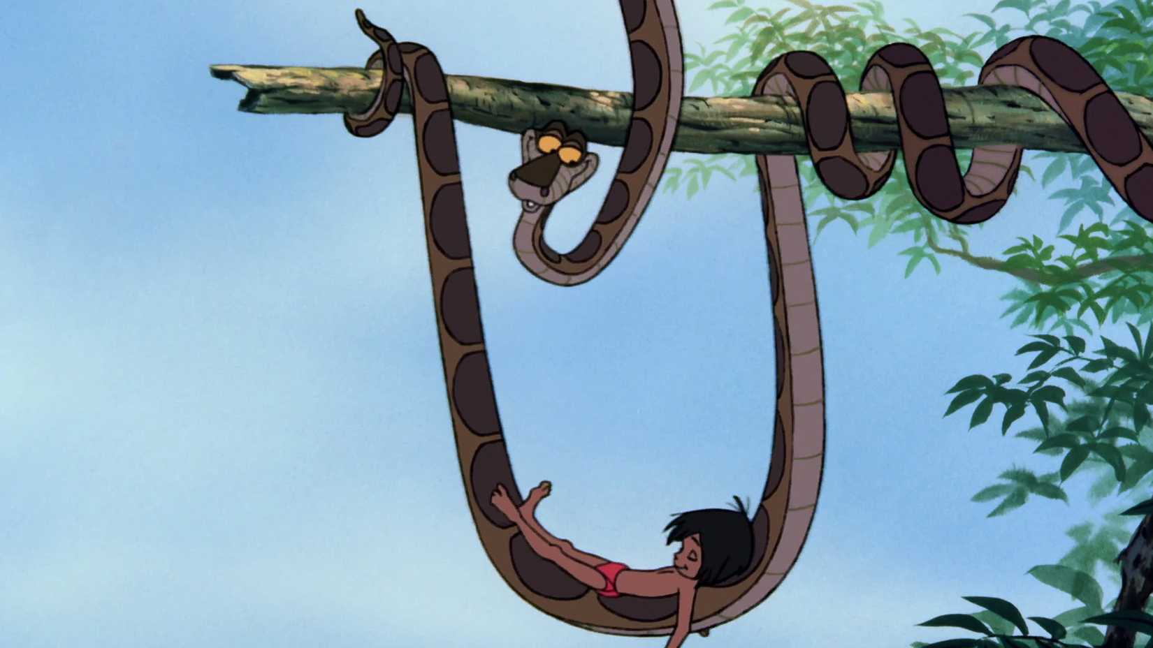 Kaa cradles Mowgli in his coils in The Jungle Book.