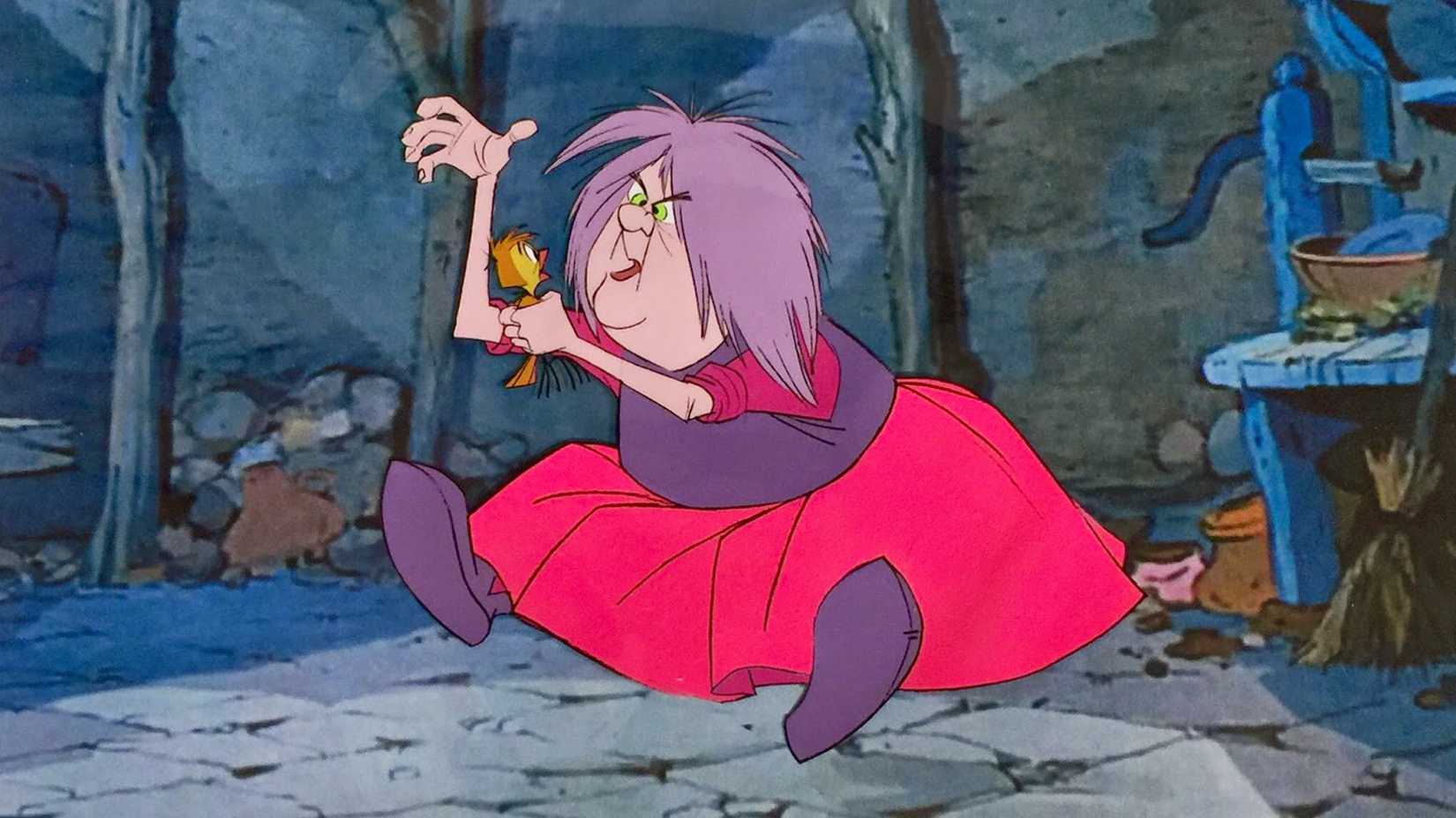 Madam Mim sits on the ground and holds a bird in The Sword in the Stone.