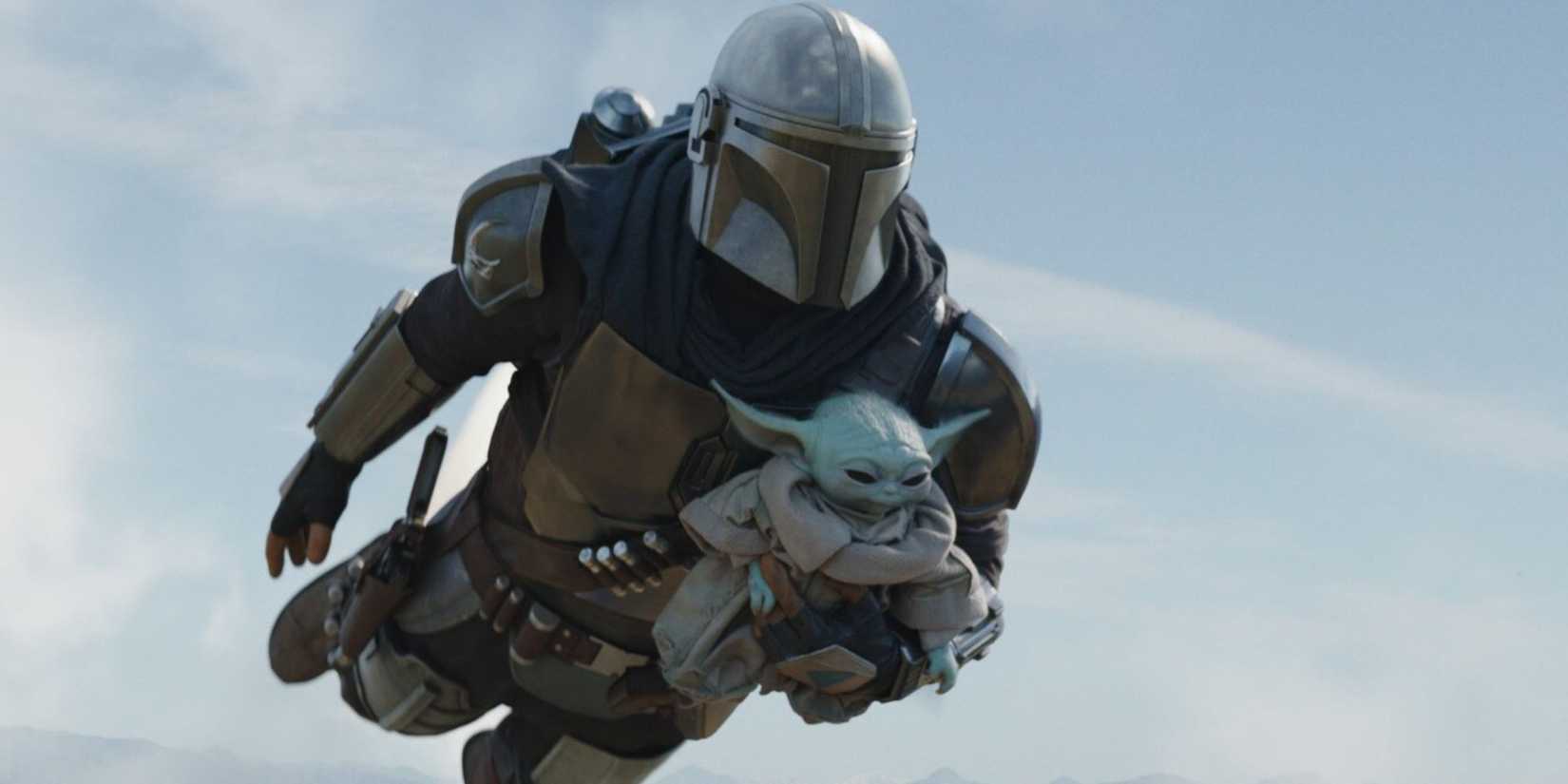 The Mandalorian flying with Grogu.