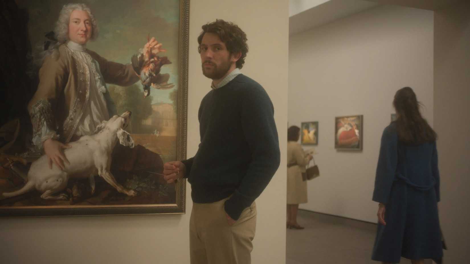 Josh O'Connor stands in an art museum in The Mastermind