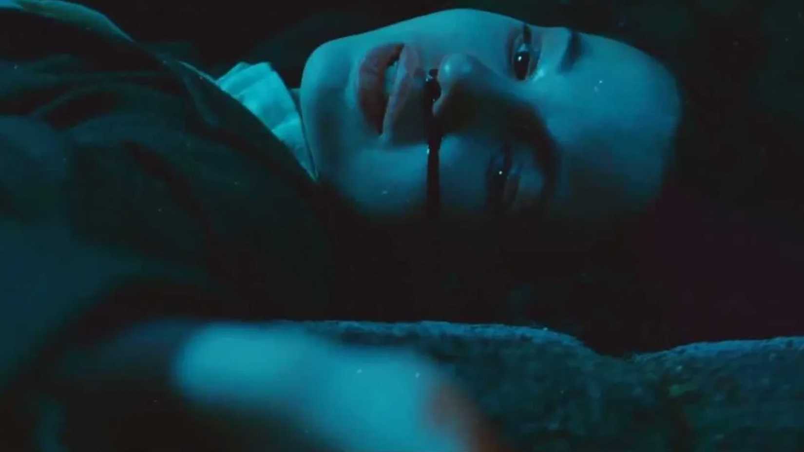 Ophelia lies on the ground with blood coming from her nose in Pan's Labyrinth.