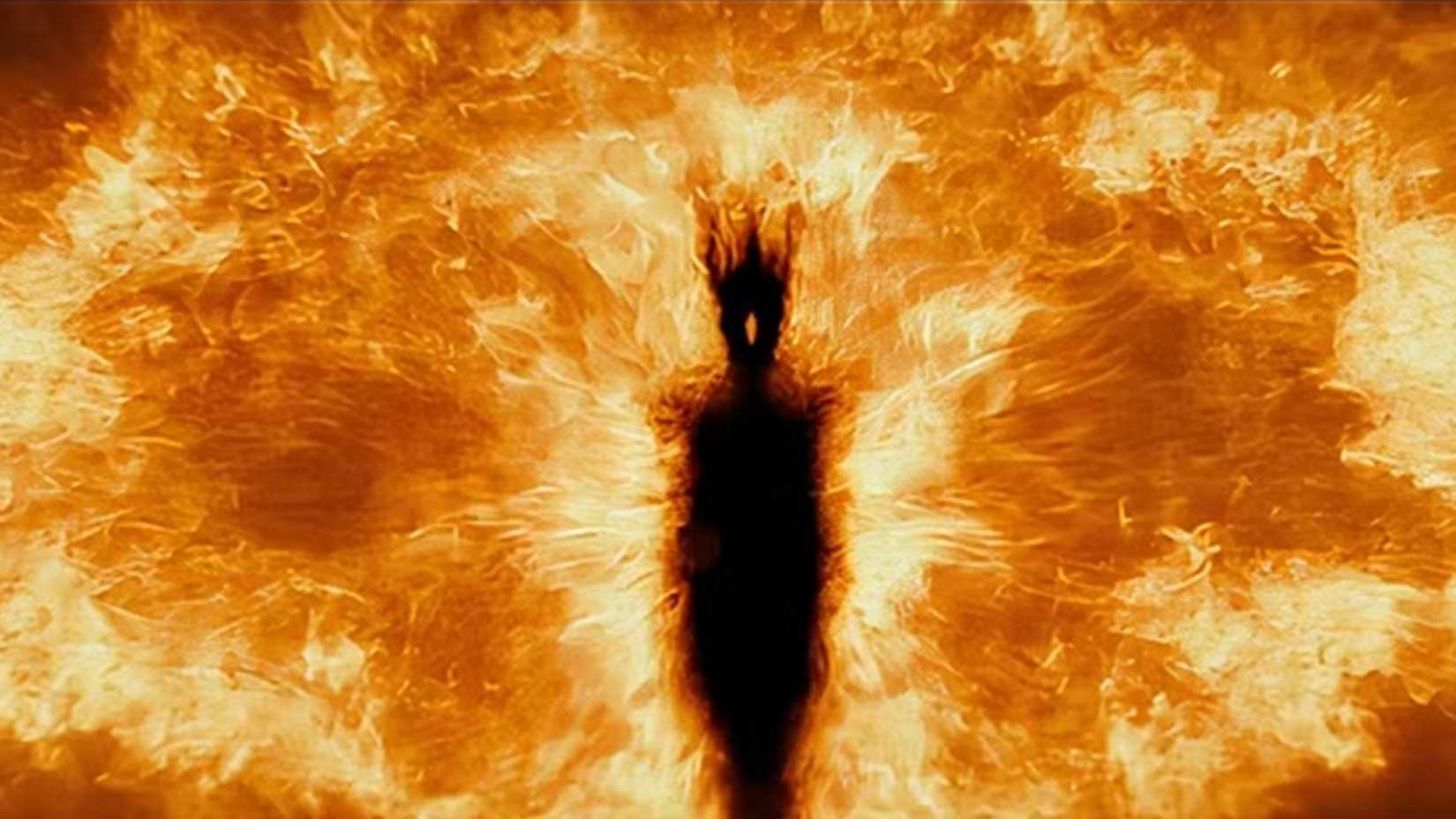 The image of Sauron seems to be coming from fire itself in The Hobbit.
