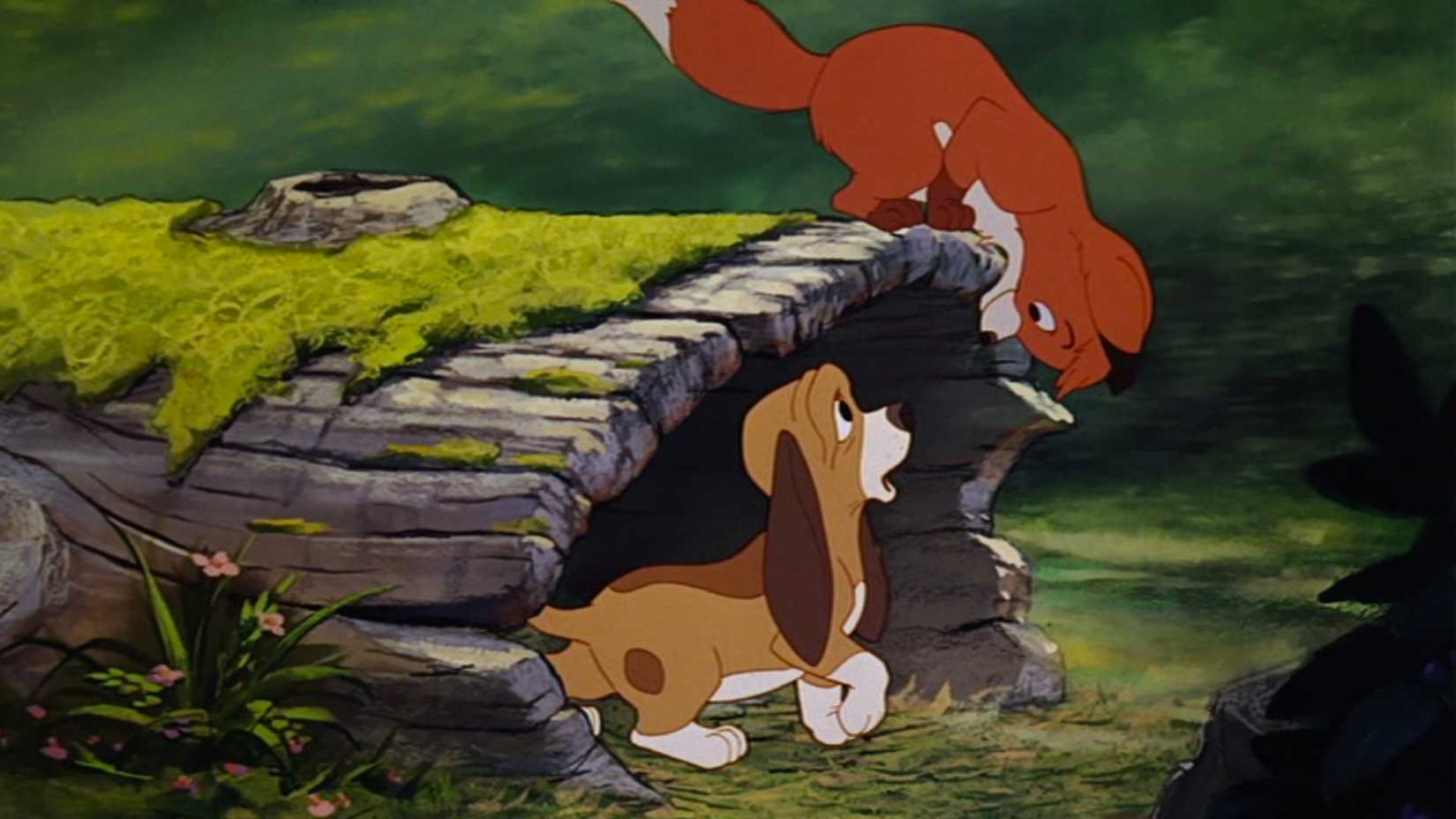 Tod stares down at Copper in a tree log in The Fox and the Hound.