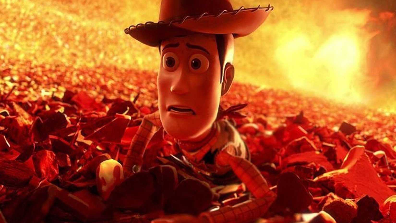 Woody looks scared and is being pulled towards an incinerator in Toy Story 3.