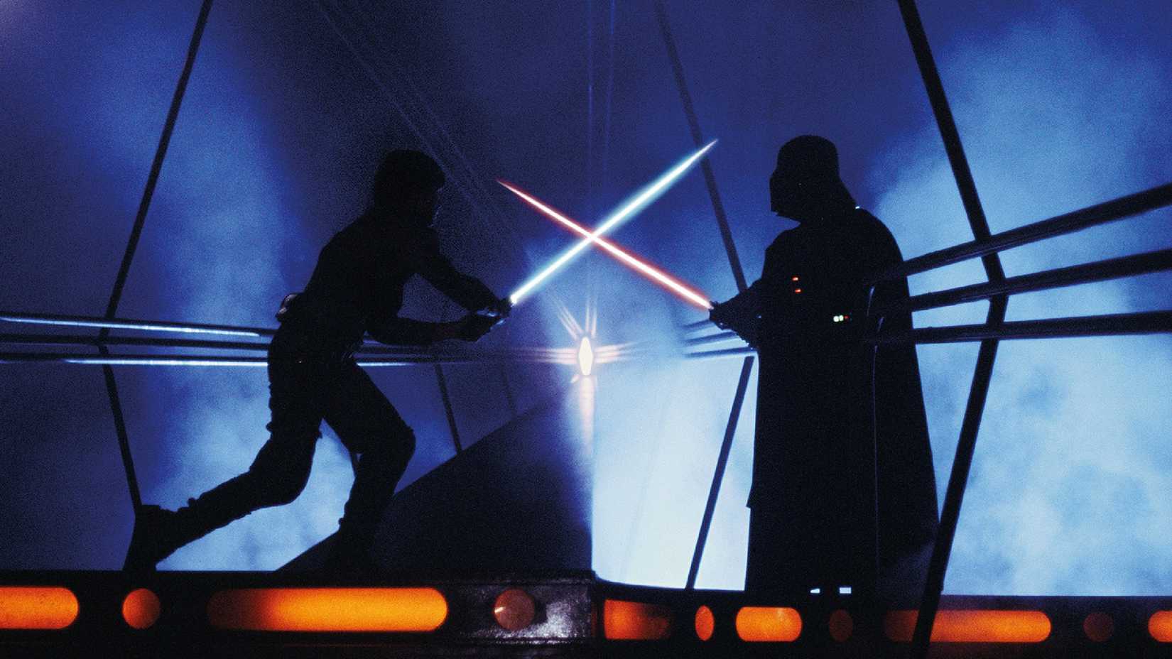 Luke Skywalker and Darth Vader cross lightsabers.
