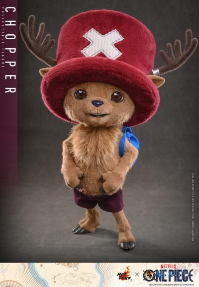 Standing 48.5 cm (19”) tall, the Tony Tony Chopper Collectible Figure has a specialized soft and squishy body covered in brown plush fabric, faithfully capturing his appearance on the live-action One Piece series on Netflix.