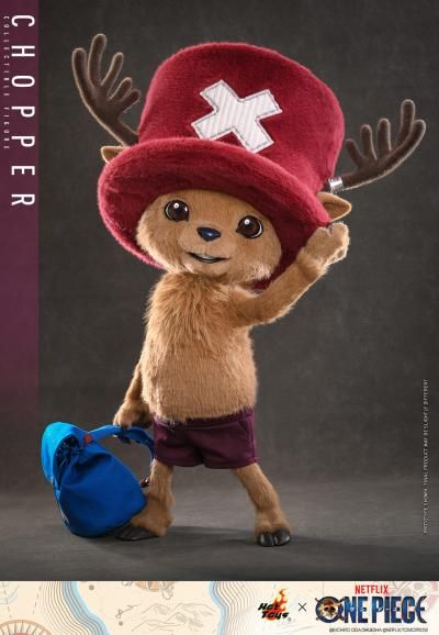 Standing 48.5 cm (19”) tall, the Tony Tony Chopper Collectible Figure has a specialized soft and squishy body covered in brown plush fabric, faithfully capturing his appearance on the live-action One Piece series on Netflix.