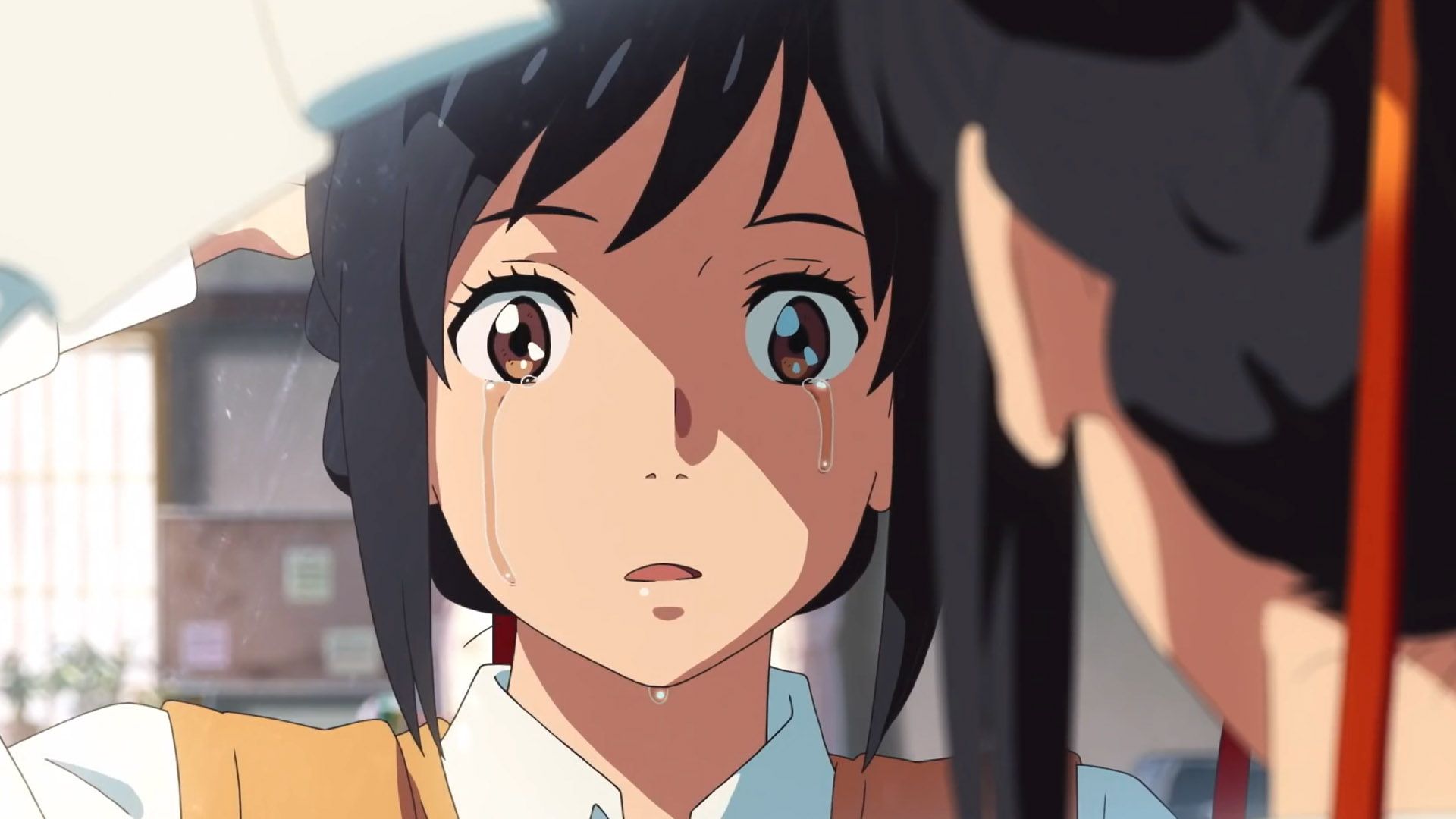 Mitsuha crying after losing her connection to Taki in Your Name