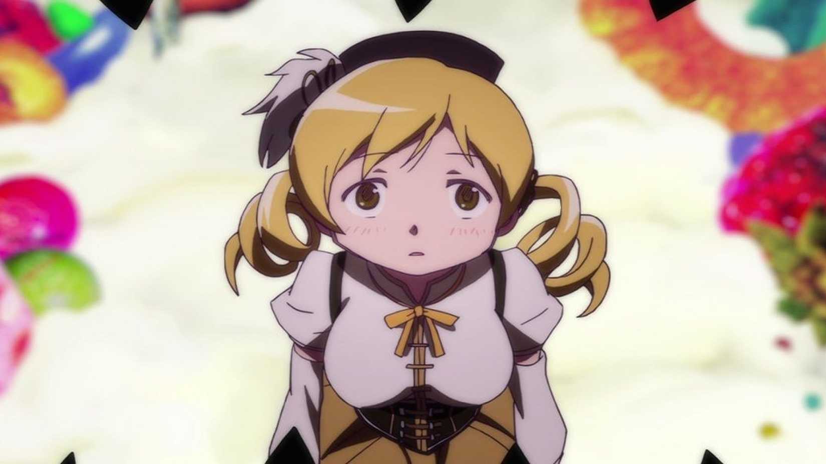 Puella Magi Madoka Magica Mami sur le point d'être tuée par Charlotte.
