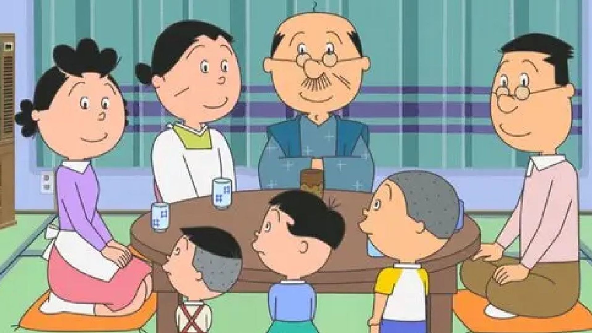 Sazae-san and family sit down around the table.