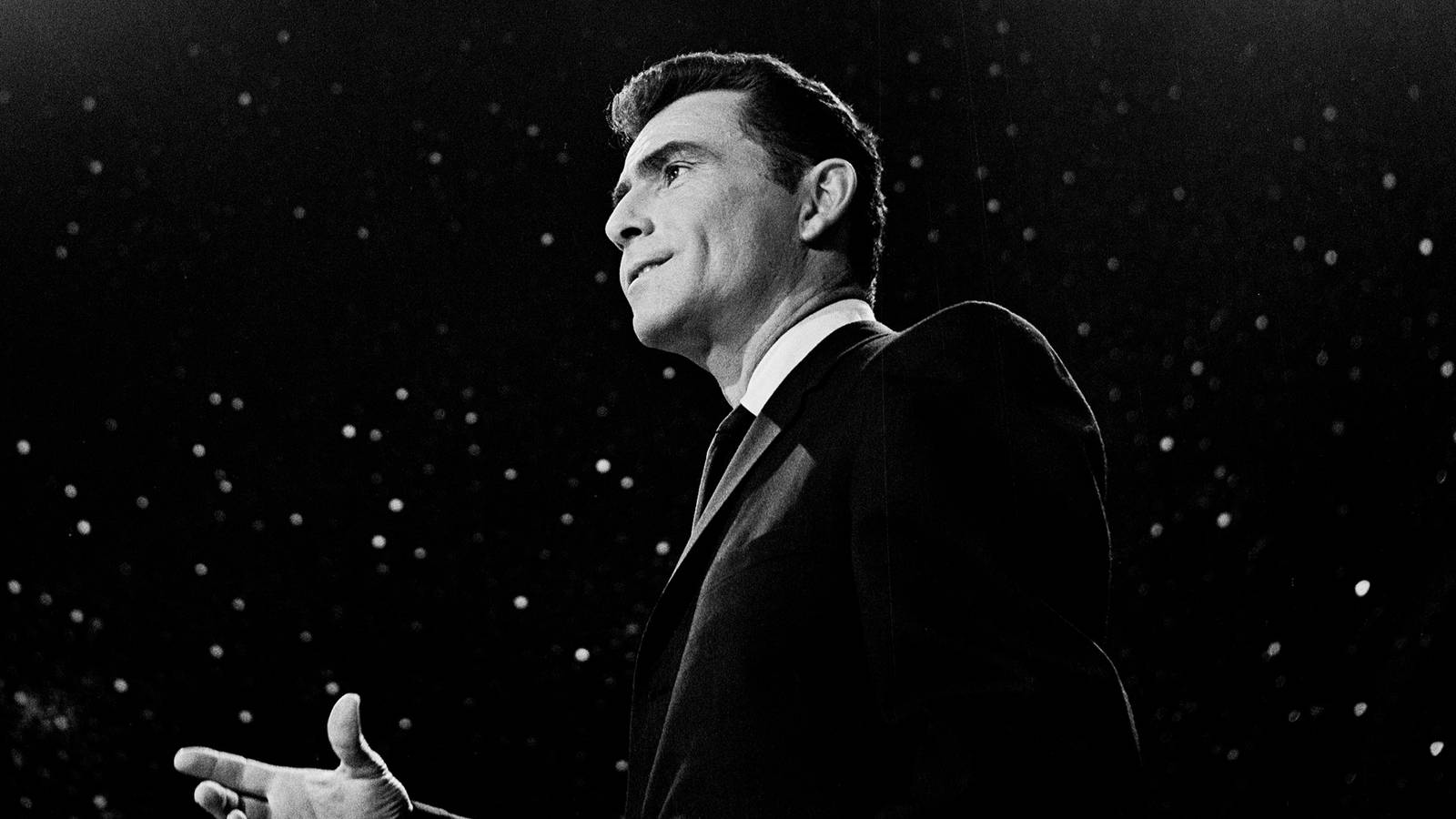 Rod Serling in front of a starfield from The Twilight Zone