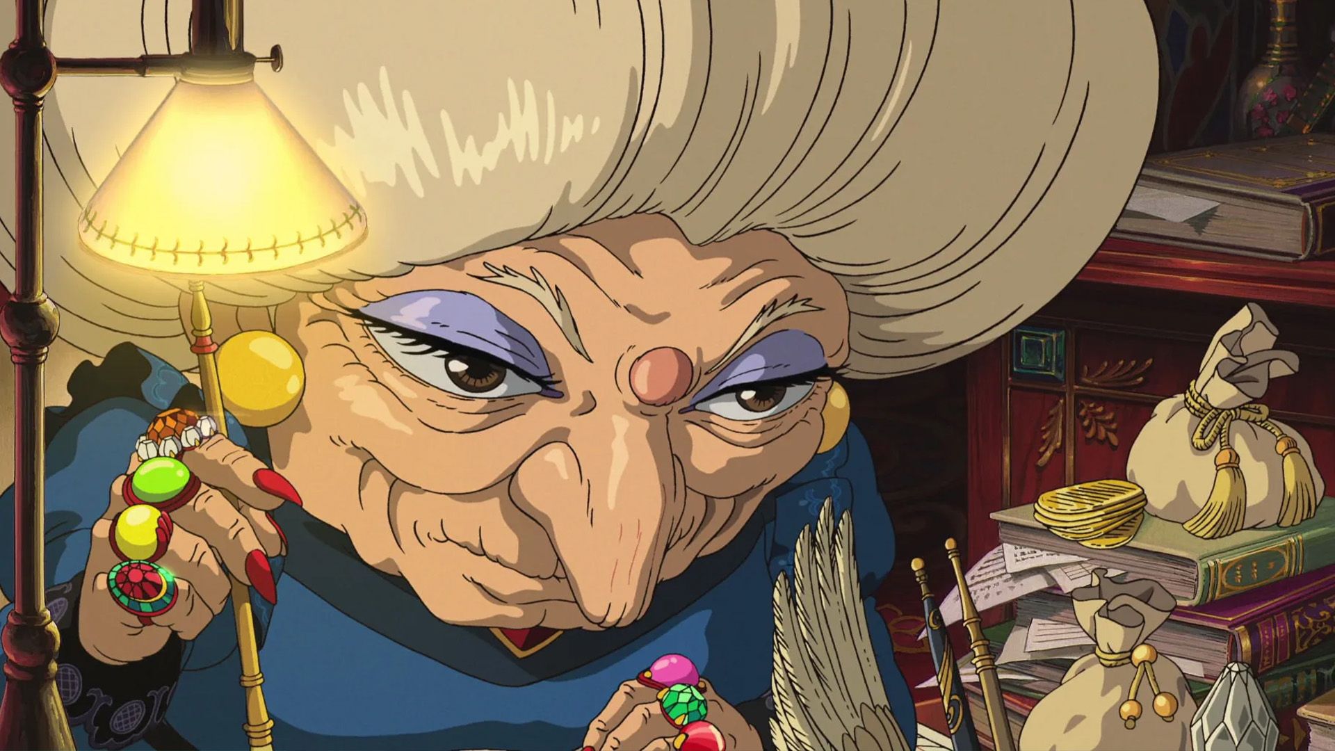 Yubaba works on paperwork in Spirited Away.