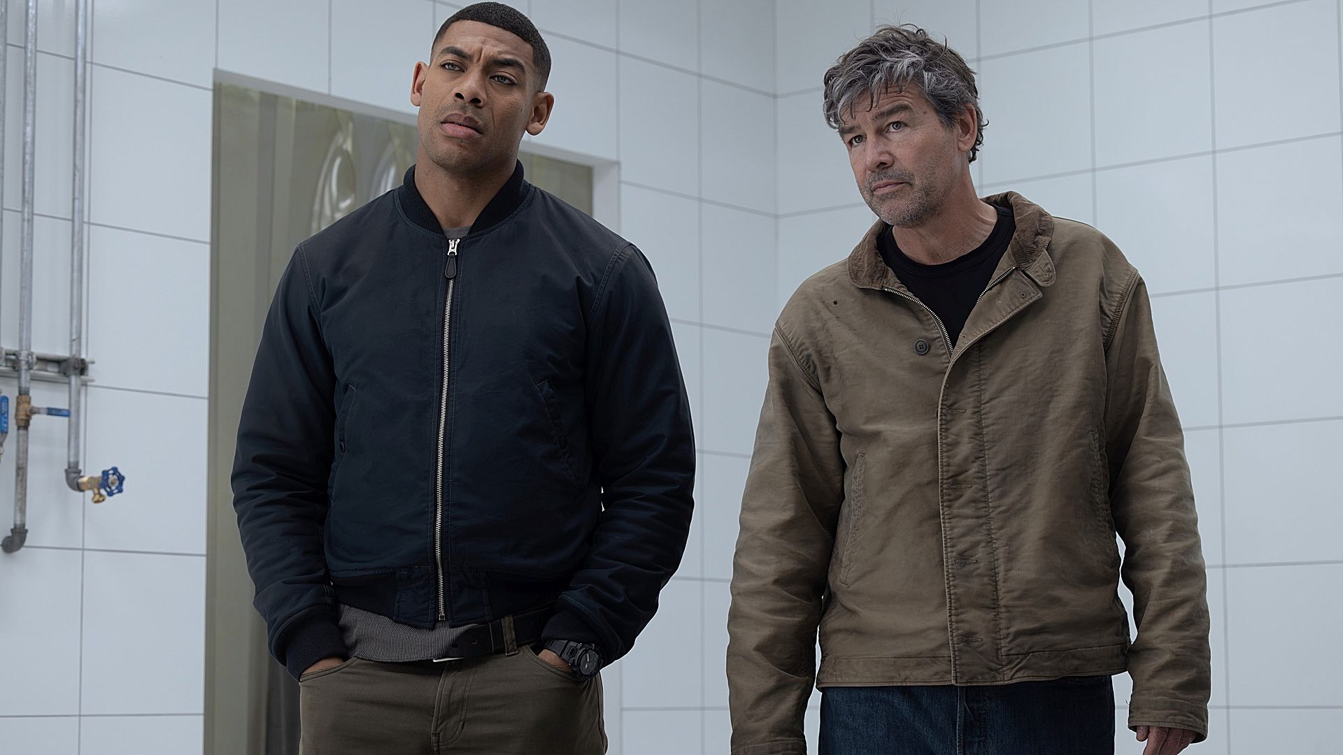 John stewart and Hal Jordan in a white room staring at something from Lanterns