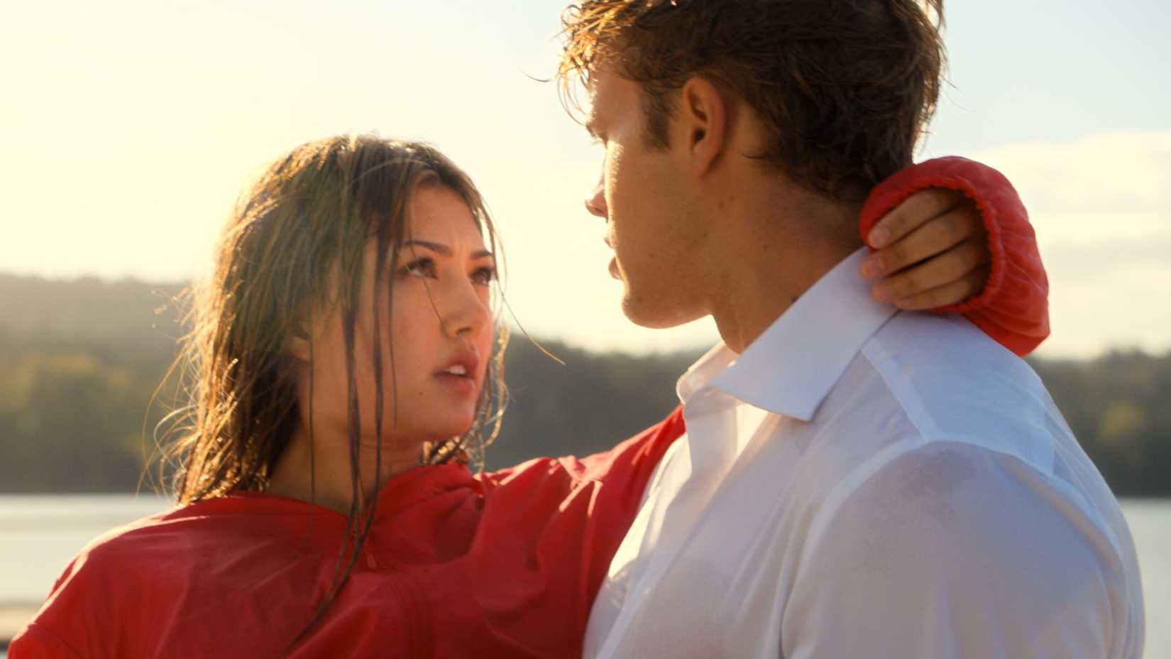 Miku Martineau as Teagan Tao and Samuel Braun as Josh Regis staring at each other on Crew Girl.