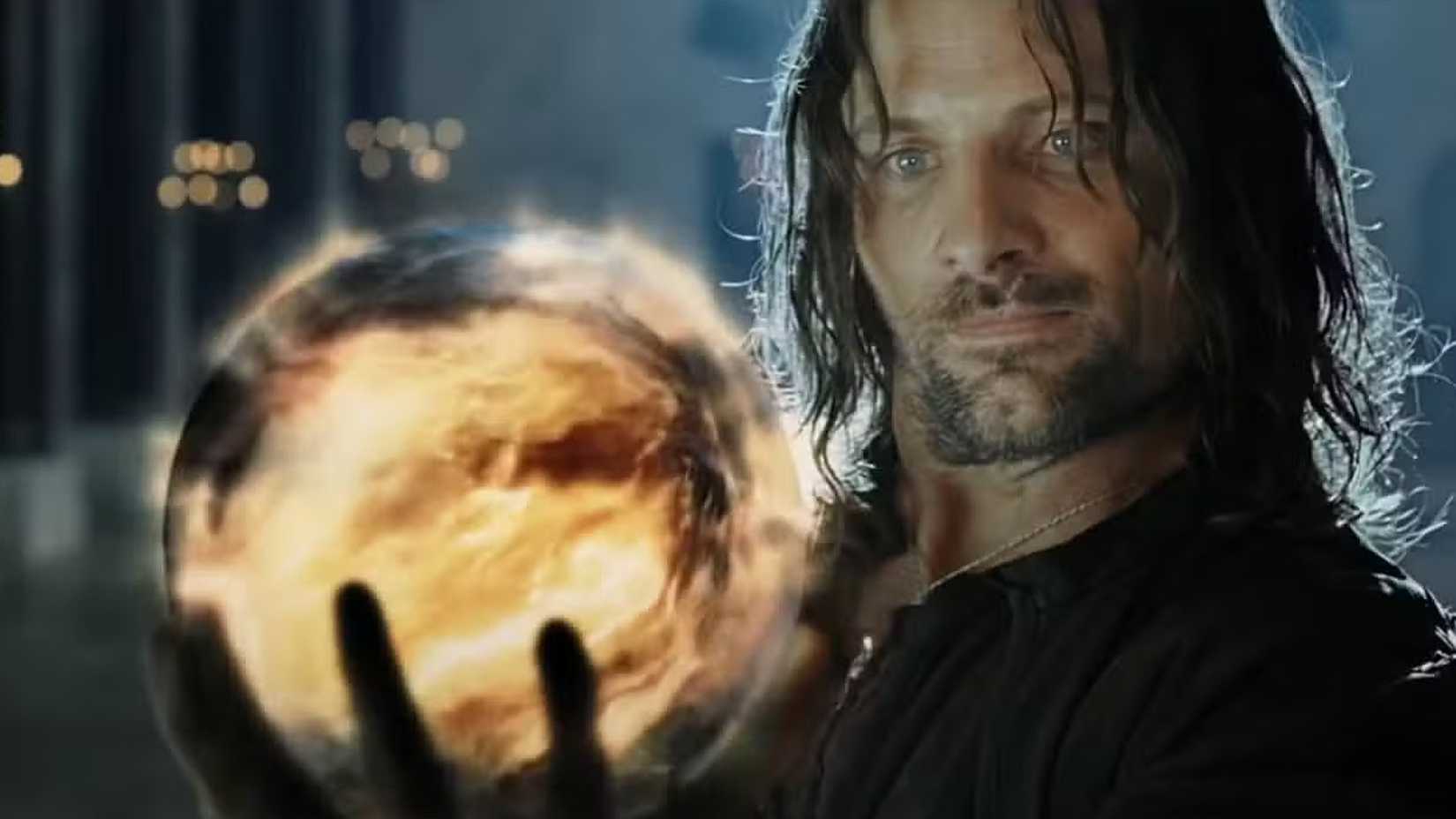 Aragorn holds up the palantir in The Lord of the Rings. 