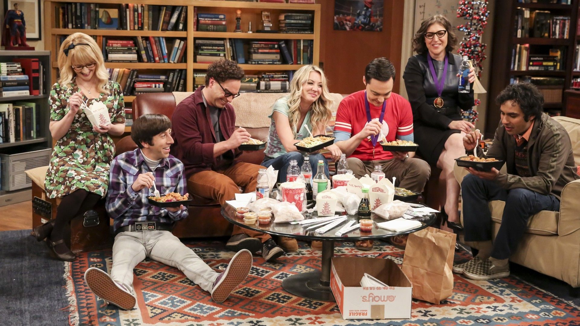 The Big Bang Theory cast eating Chinese takeout in Sheldon and Leonard's living room.