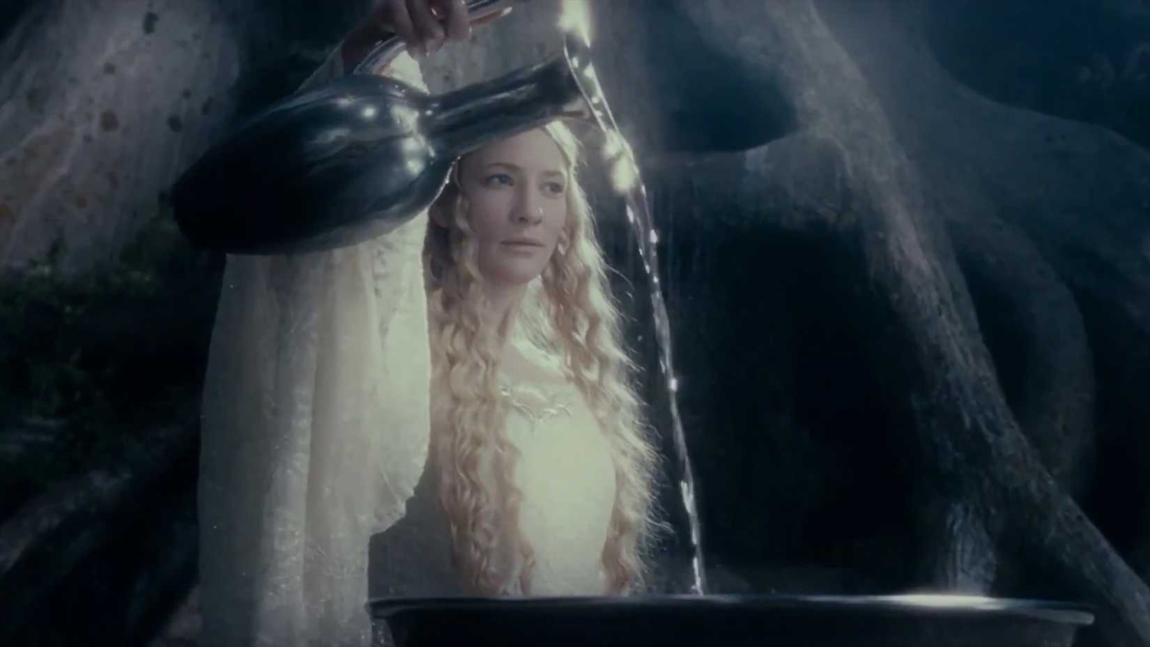 Galadriel pours water into her mirror in The Lord of the Rings. 