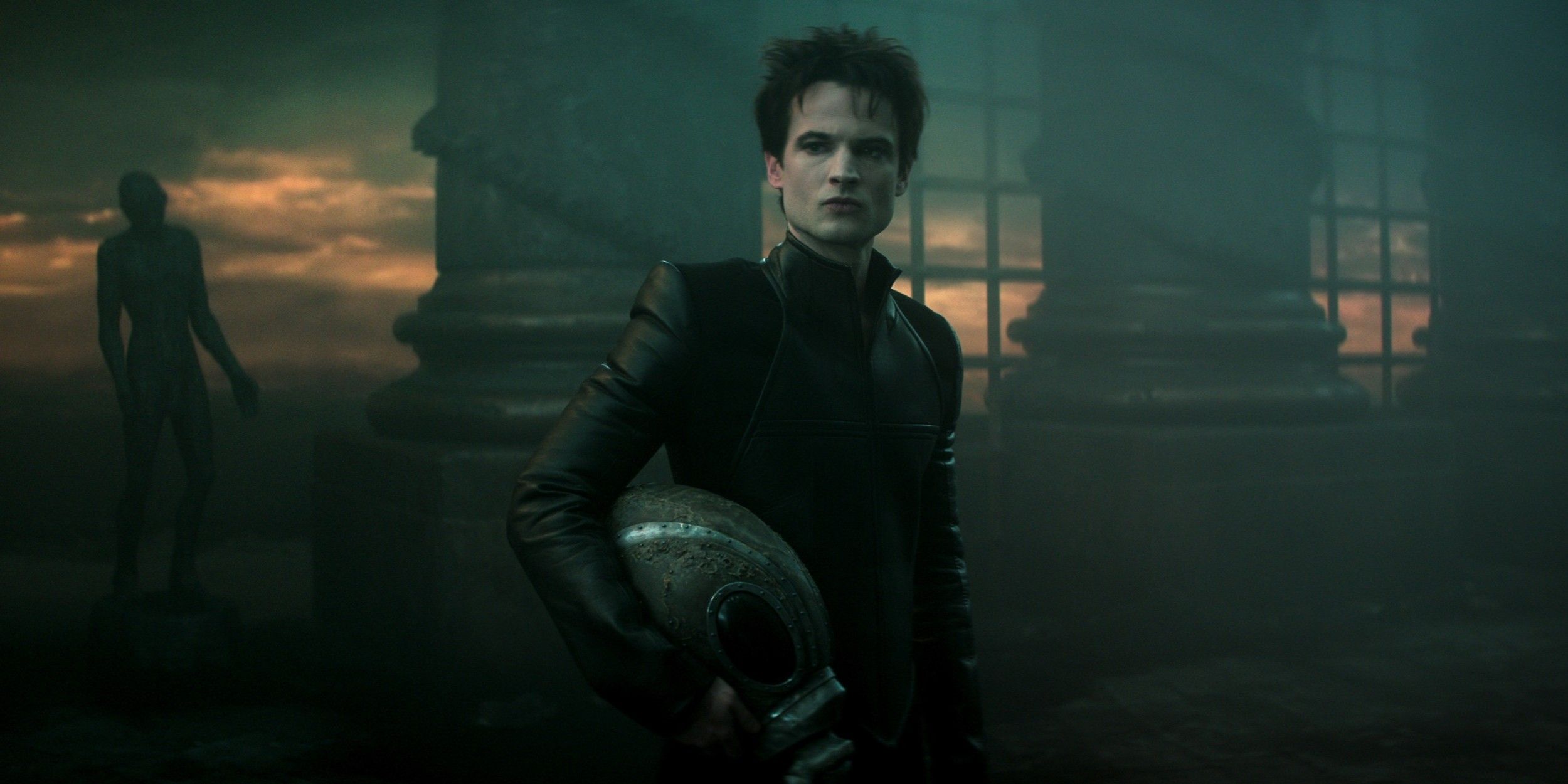 Morpheus (Tom Sturridge) standing in Hell with his helm in The Sandman Season 2.