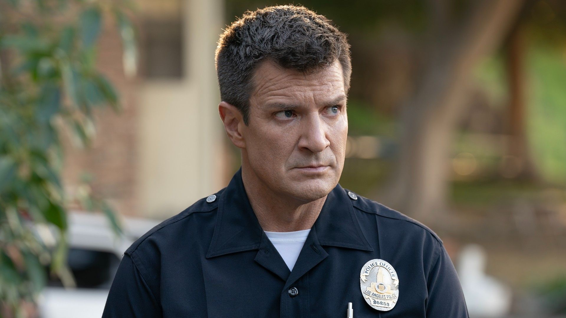 Nathan Fillion as John Nolan in his uniform on The Rookie