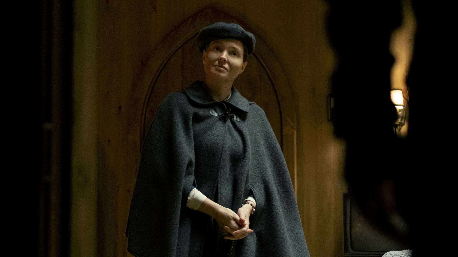 Samantha Sloyan and a shadowy figure from Midnight Mass